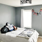 kids bedroom with hockey light fixture