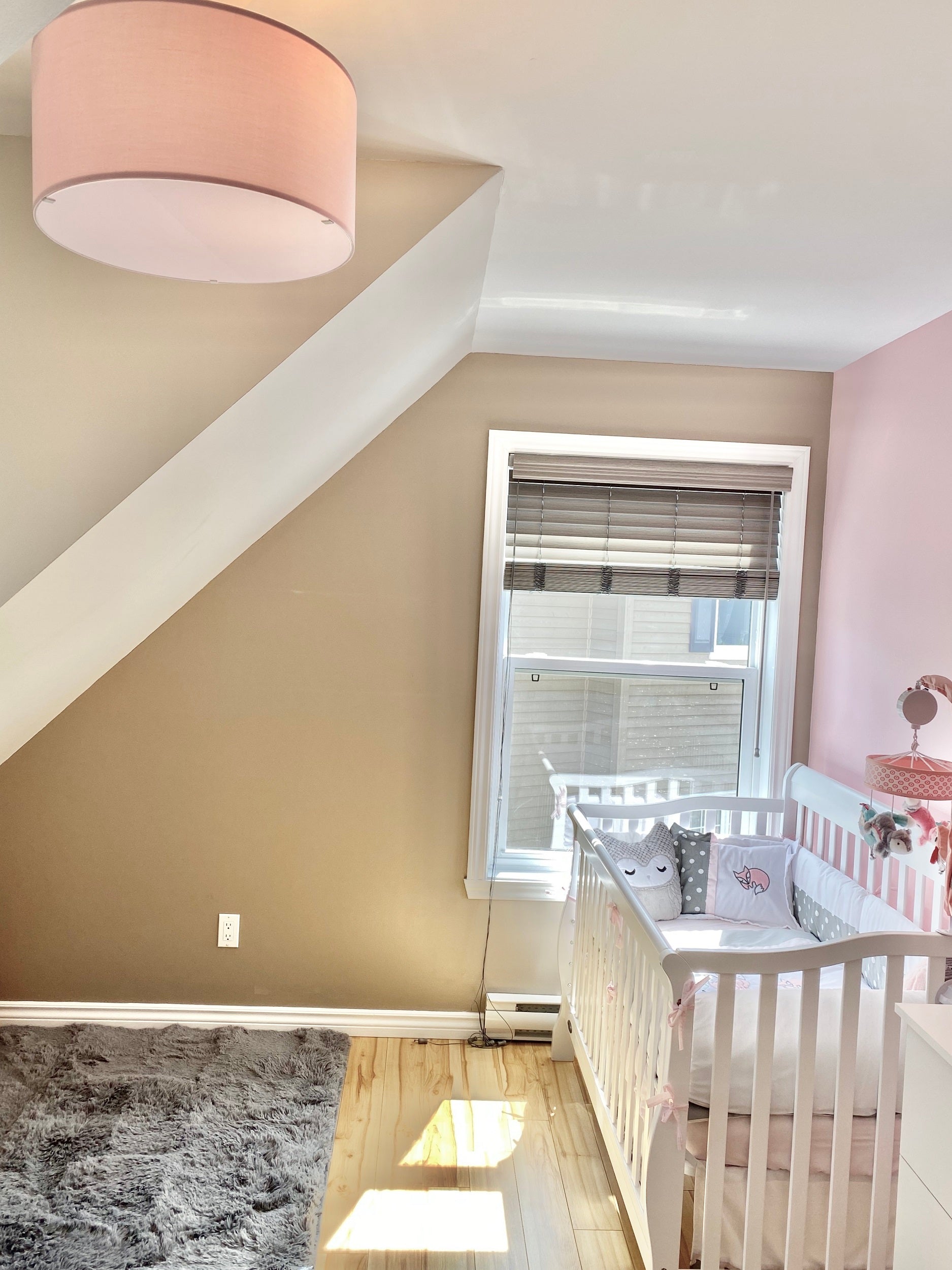 Pink ceiling lamp in nursery room