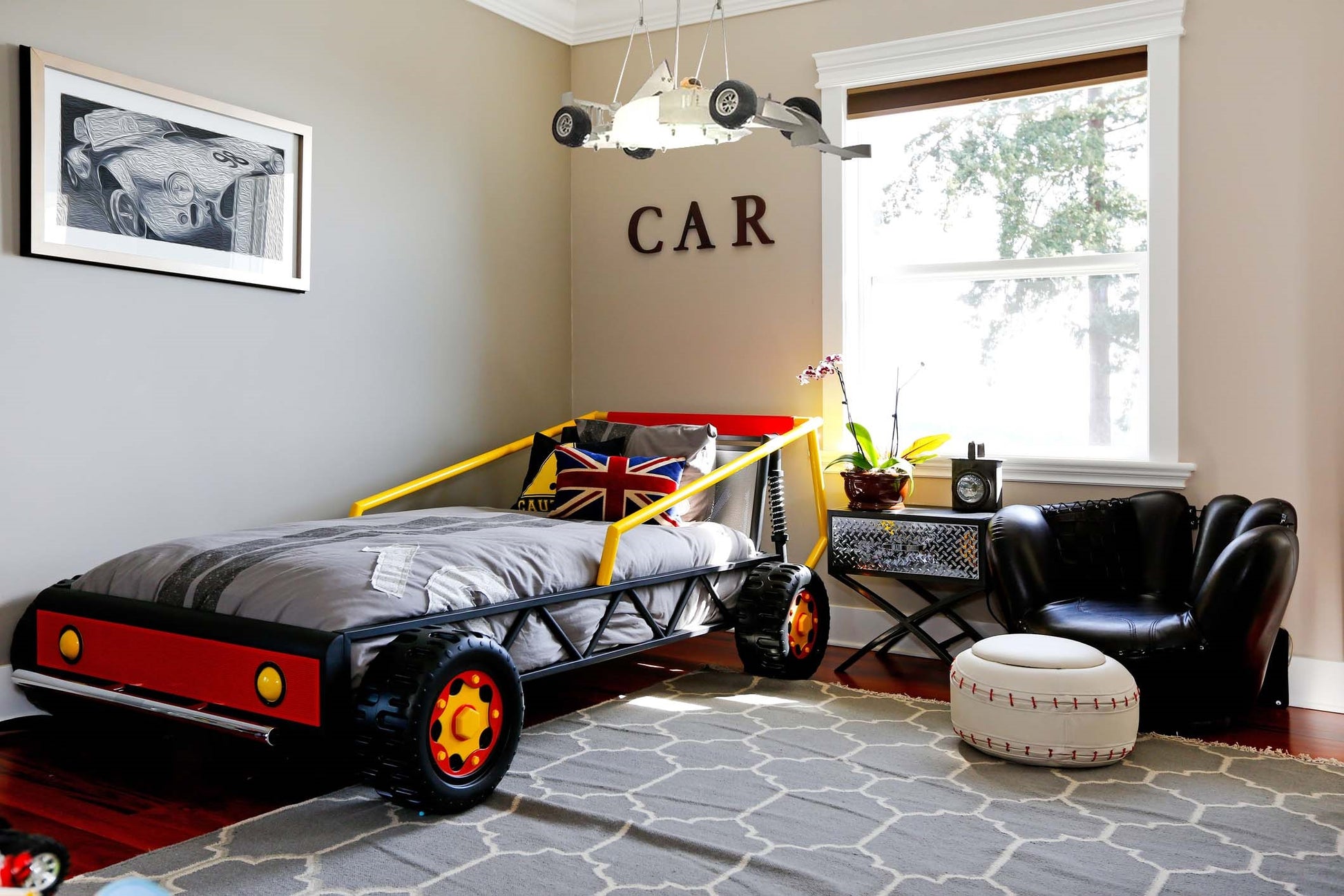 kids room with a race car chandelier, kids bedroom with car ceiling light