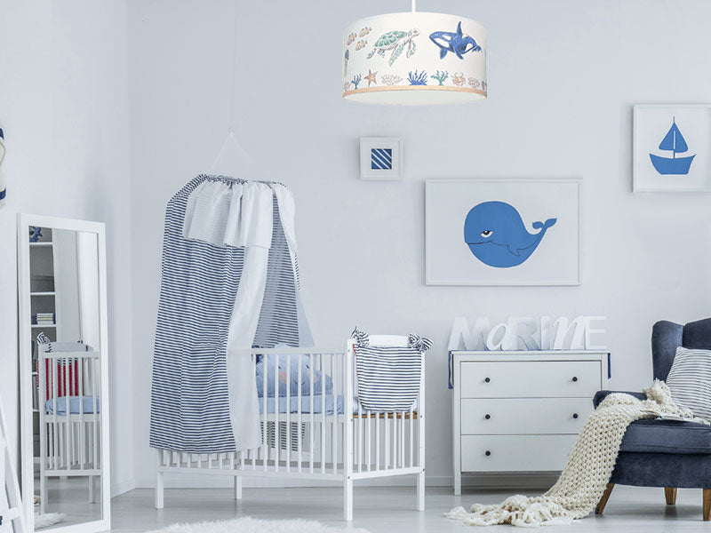 kids nursery with under the sea theme, nursery with ocean theme decor, kids room with ocean light fixture