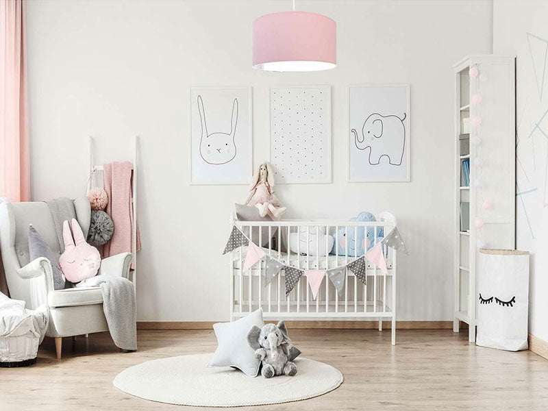 pink light fixture in nursery room