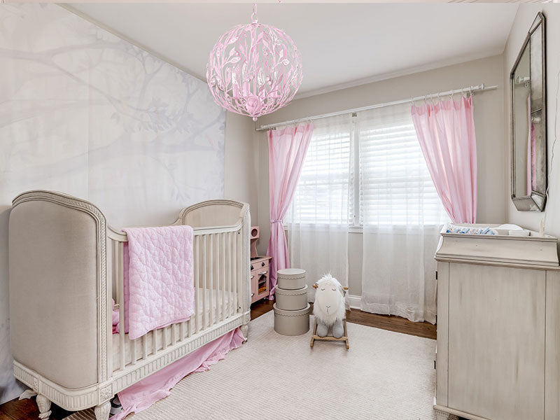 pink round chandelier in nursery, pink globe chandelier in baby's room