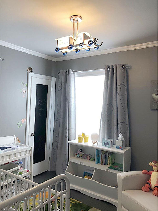 Nursery room with train chandelier, nursery bedroom with train light fixture