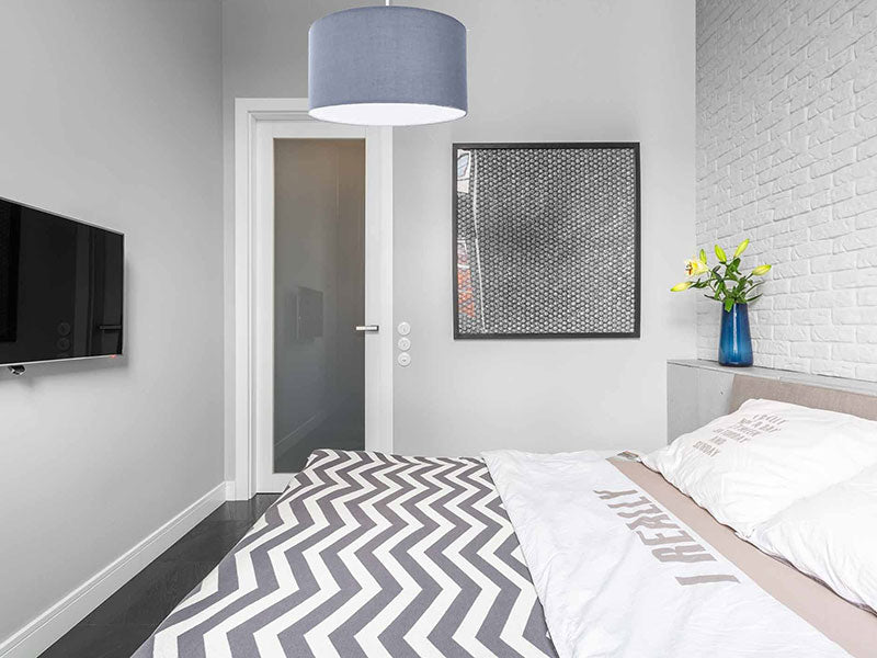 bedroom with grey light fixture