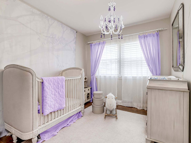 Nursery room with purple chandelier