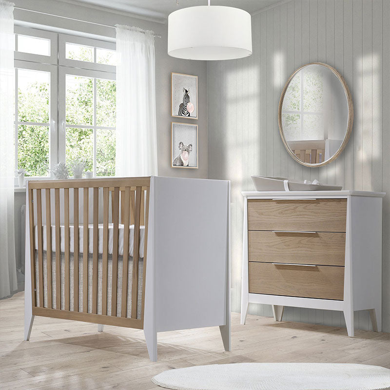 modern nursery with white ceiling light, white and wood nursery room with white light fixture